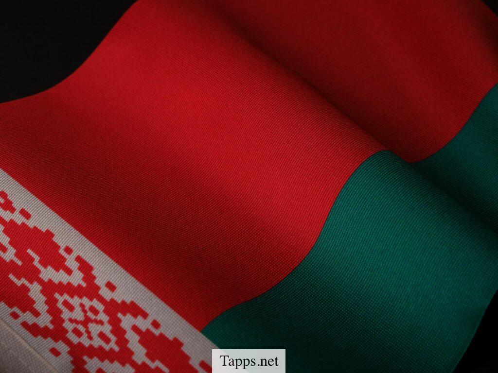 A close-up of the Belarusian flag showing its vibrant colors and intricate patterns.
