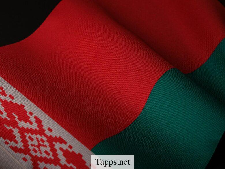 A close-up of the Belarusian flag showing its vibrant colors and intricate patterns.