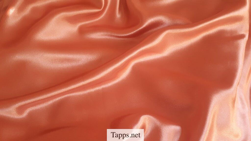 orange textile close-up photography