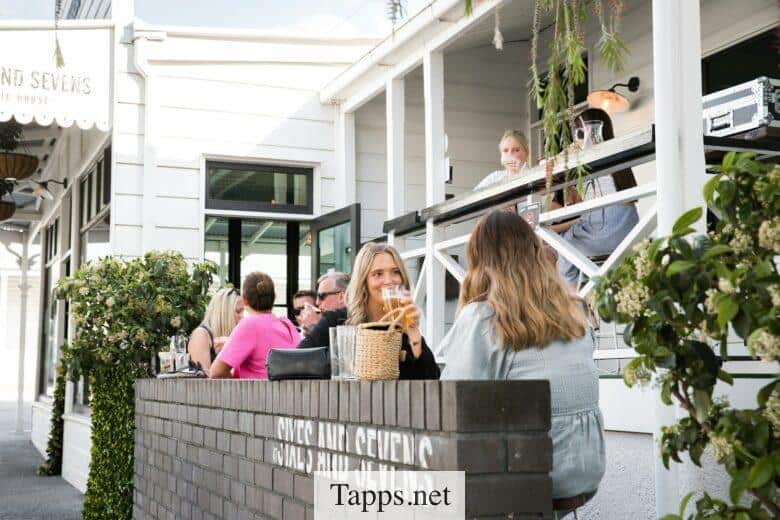 people sitting on gray concrete bench during daytime